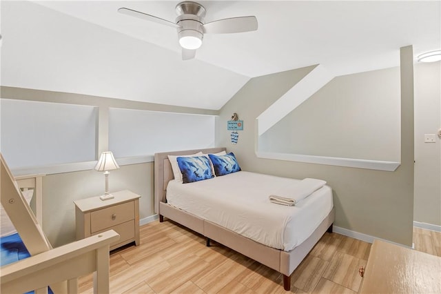4901 State Highway 361 Unit 126, Port Aransas, TX 78373 - bedroom with wood finished floors, vaulted ceiling, and ceiling fan