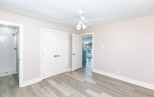 unfurnished bedroom featuring light hardwood / wood-style floors, ceiling fan, and a closet