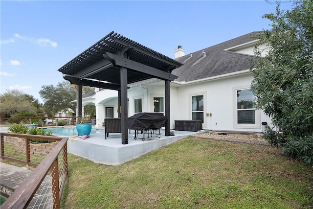 rear view of property with a patio, a pergola, a lawn, stucco siding, and a chimney