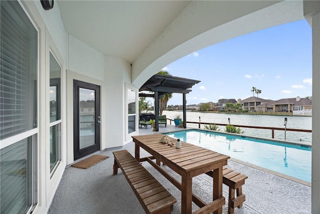 balcony with a water view and a patio