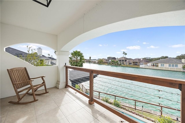 balcony with a water view and a residential view