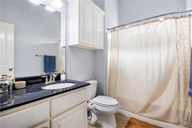 full bathroom with toilet, shower / tub combo, vanity, and tile patterned floors