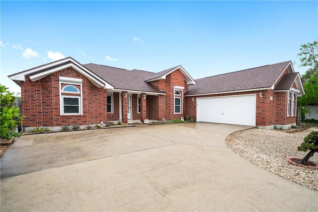 ranch-style house featuring brick siding, driveway, a shingled roof, and an attached garage