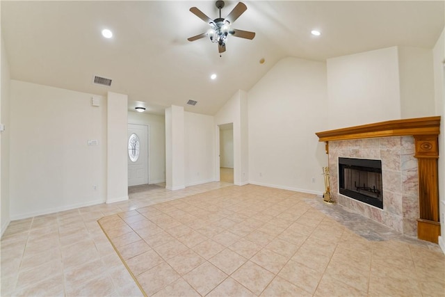 unfurnished living room with a tiled fireplace, a ceiling fan, light tile patterned flooring, and visible vents