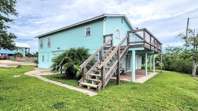 619 Copano Cove Rd, Rockport, TX 78382 - back of house with a yard, a deck, and stairs
