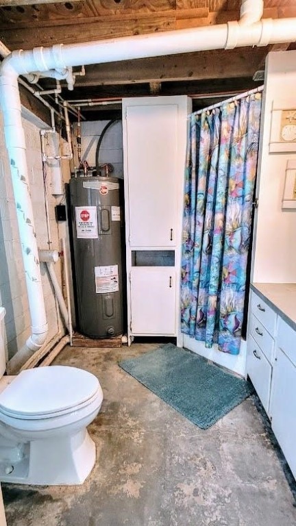 619 Copano Cove Rd, Rockport, TX 78382 - full bath featuring electric water heater, concrete flooring, a shower with curtain, and vanity