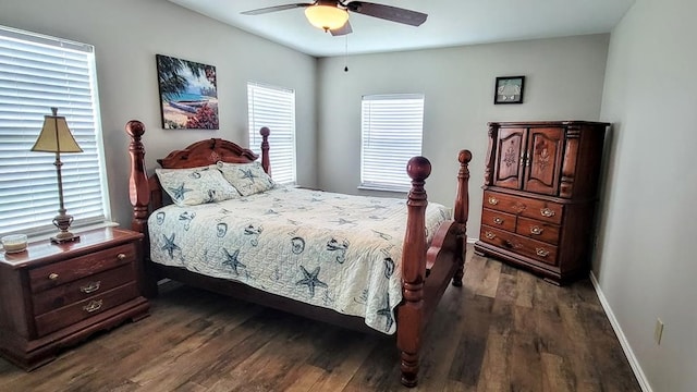 619 Copano Cove Rd, Rockport, TX 78382 - bedroom with dark wood-style flooring and ceiling fan