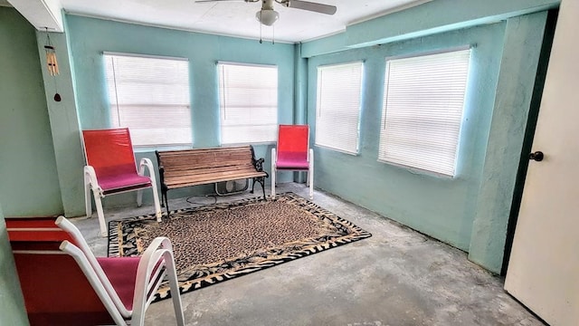 619 Copano Cove Rd, Rockport, TX 78382 - living area with ceiling fan and concrete floors