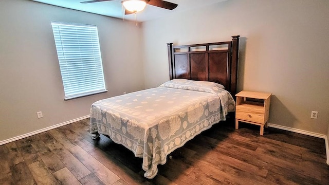 619 Copano Cove Rd, Rockport, TX 78382 - bedroom with wood finished floors, a ceiling fan, and multiple windows