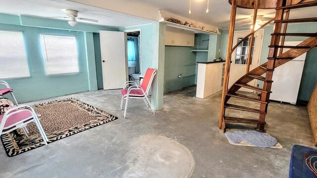 619 Copano Cove Rd, Rockport, TX 78382 - basement with stairway and ceiling fan