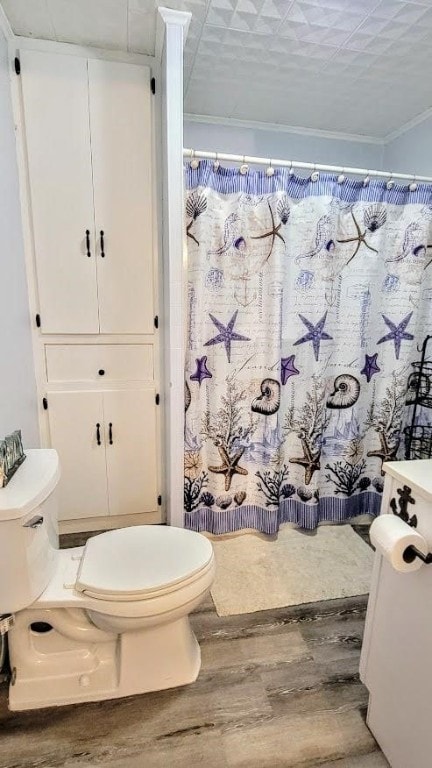 619 Copano Cove Rd, Rockport, TX 78382 - full bath with wood finished floors, ornamental molding, and curtained shower
