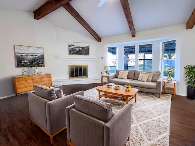 living room featuring hardwood / wood-style floors, a brick fireplace, and lofted ceiling with beams