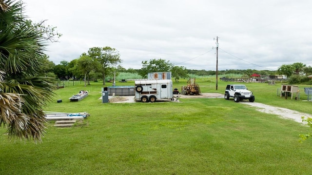 surrounding community with a yard