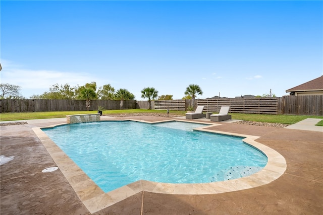 view of pool with a patio, a yard, a fenced backyard, and a fenced in pool