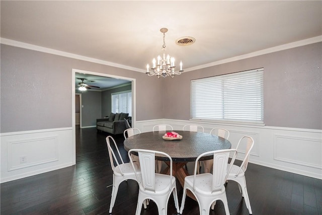 4822 Augusta Dr, Corpus Christi, TX 78413 - dining space featuring wainscoting, crown molding, a chandelier, ceiling fan, and dark wood finished floors