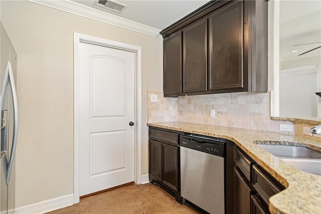 2706 Lake Rhapsody Dr, Corpus Christi, TX 78414 - kitchen with stainless steel appliances, dark brown cabinetry, crown molding, tasteful backsplash, and recessed lighting