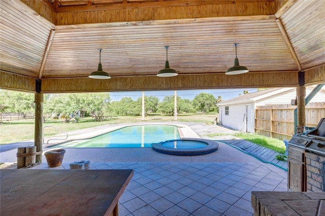 5353 County Rd 73, Robstown, TX 78380 - view of swimming pool with a ceiling fan, a patio, area for grilling, and a pool with connected hot tub