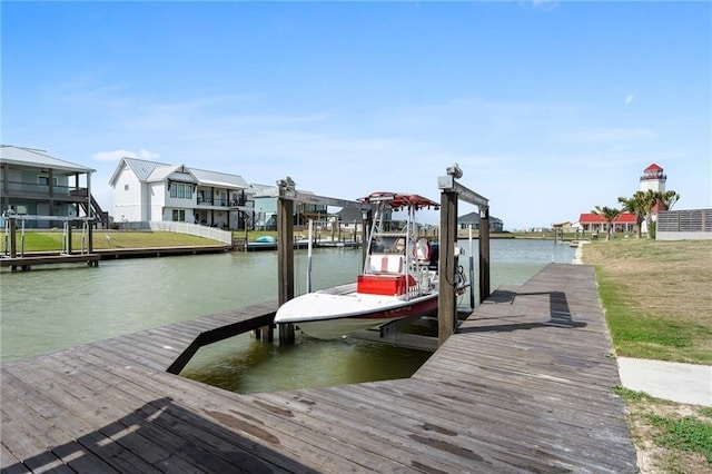 view of dock featuring boat lift and a water view