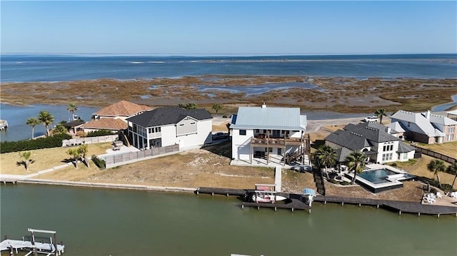 birds eye view of property featuring a residential view and a water view