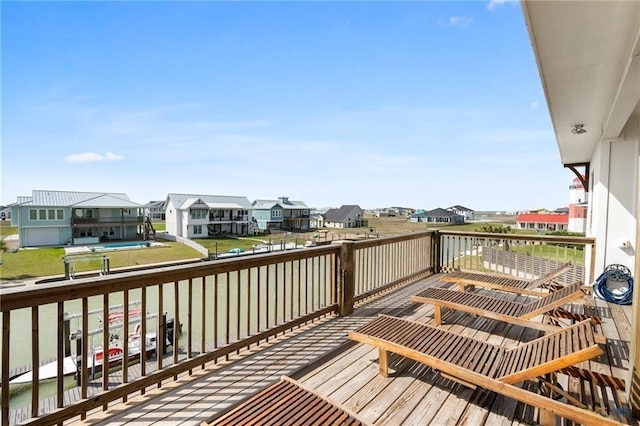 wooden terrace featuring a residential view