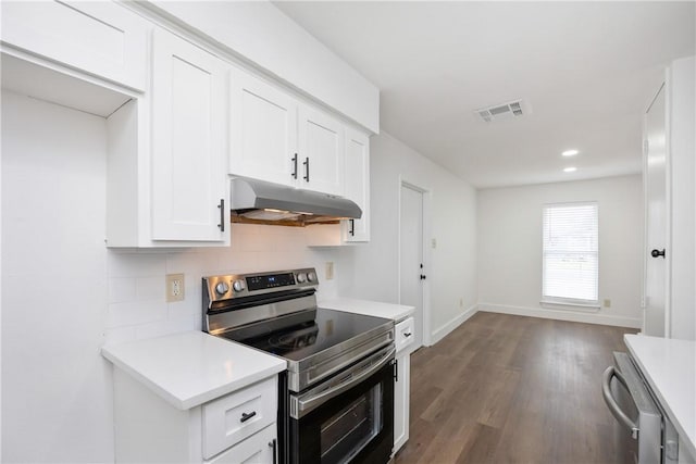 kitchen with white cabinets, decorative backsplash, dark hardwood / wood-style flooring, and stainless steel appliances