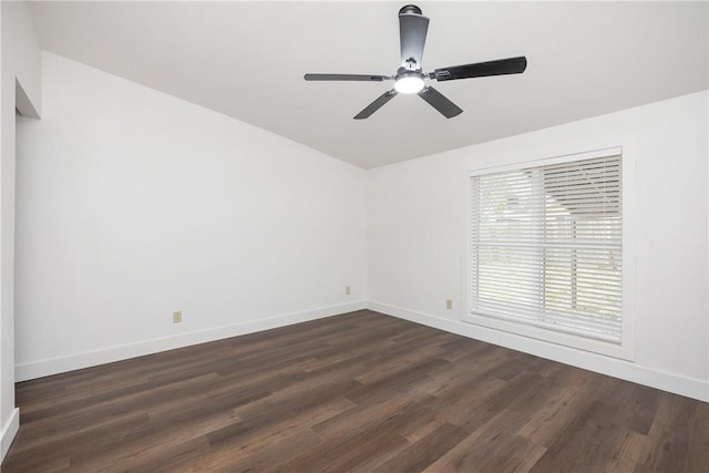 spare room featuring dark hardwood / wood-style flooring and ceiling fan