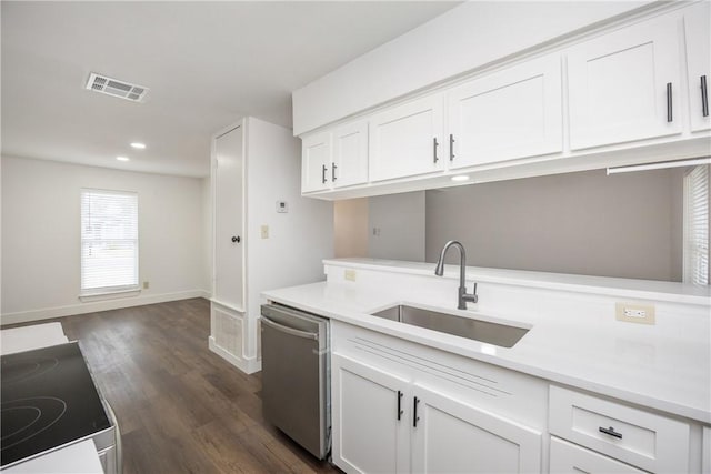 kitchen with stove, white cabinets, dark wood-type flooring, sink, and dishwasher