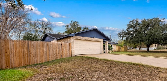 view of property exterior featuring a garage