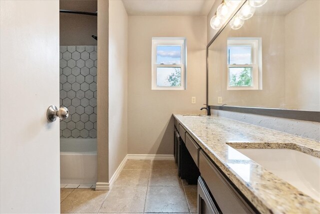 bathroom with vanity and shower / washtub combination