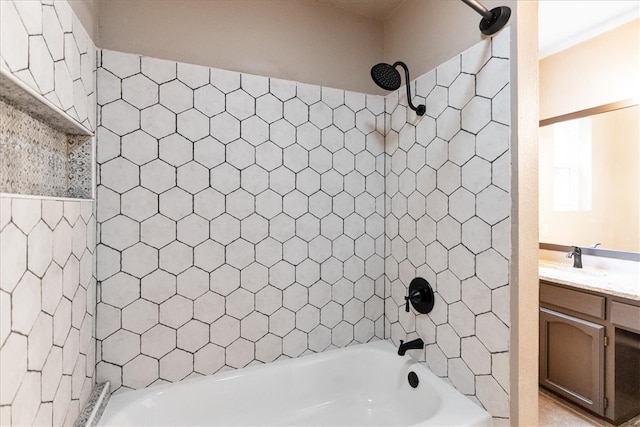 bathroom with vanity and tiled shower / bath