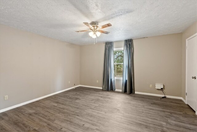 unfurnished room with dark hardwood / wood-style floors, ceiling fan, and a textured ceiling