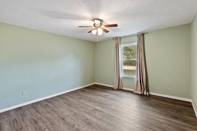 empty room with wood-type flooring, a textured ceiling, and ceiling fan