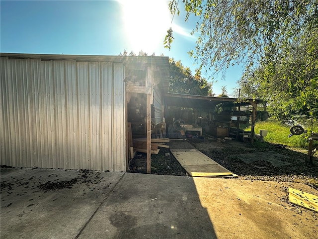 view of home's exterior featuring an outbuilding