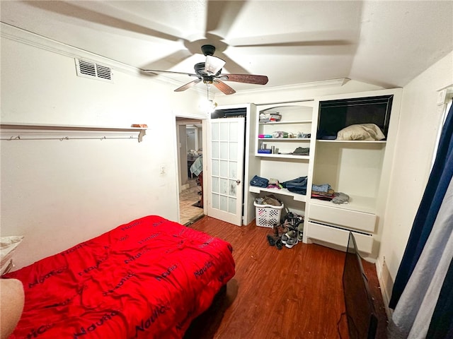 bedroom with ceiling fan, dark hardwood / wood-style flooring, and vaulted ceiling