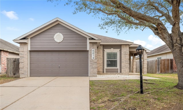 ranch-style house with concrete driveway, brick siding, fence, and an attached garage