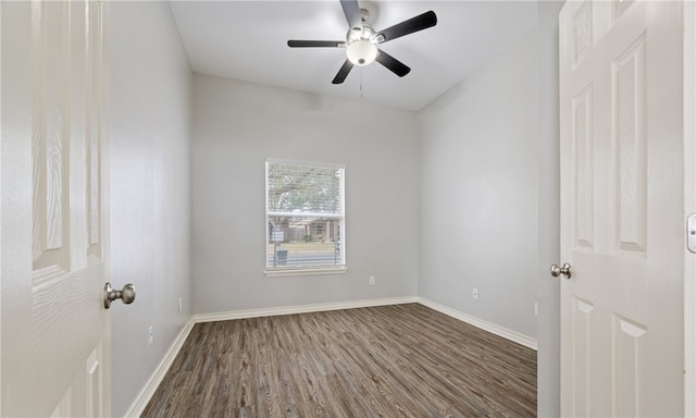 unfurnished room with dark wood finished floors, baseboards, and ceiling fan