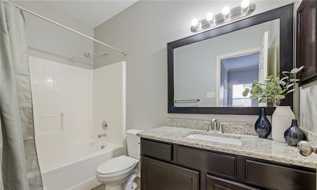 bathroom with toilet, shower / tub combo, and vanity