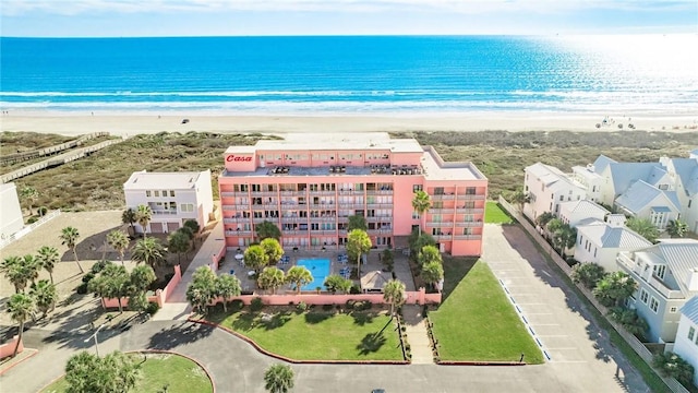 aerial view with a water view and a beach view