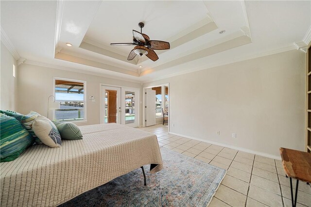 15929 San Felipe Dr, Corpus Christi, TX 78418 - bedroom with multiple windows, light tile patterned floors, a tray ceiling, baseboards, and crown molding
