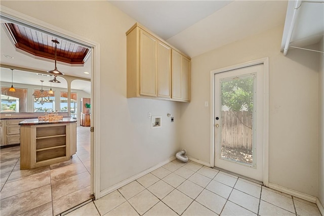 15929 San Felipe Dr, Corpus Christi, TX 78418 - laundry area featuring hookup for an electric dryer, washer hookup, baseboards, cabinet space, and light tile patterned floors