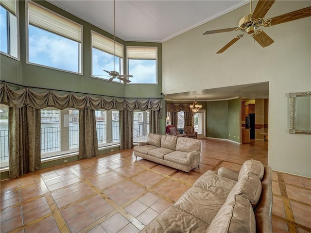 15806 Punta Espada, Corpus Christi, TX 78418 - living room featuring a towering ceiling, ceiling fan, ornamental molding, inlaid floor details, and tile patterned flooring