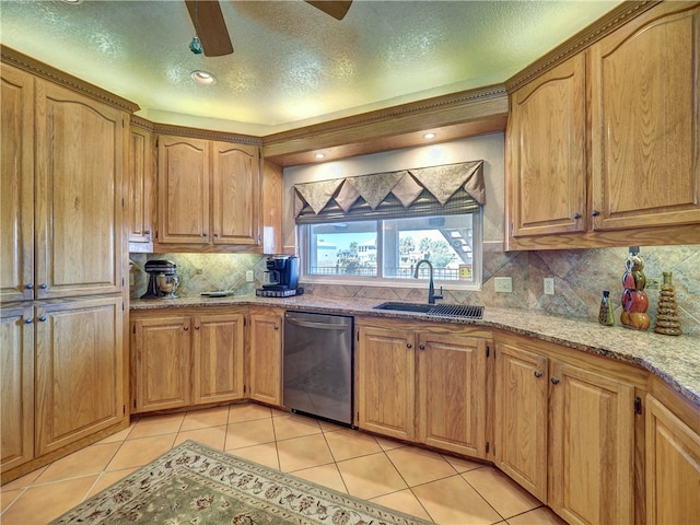 kitchen featuring sink, backsplash, light stone countertops, light tile patterned flooring, and stainless steel dishwasher