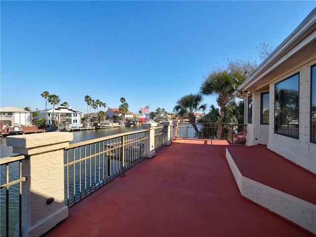 wooden terrace with a water view