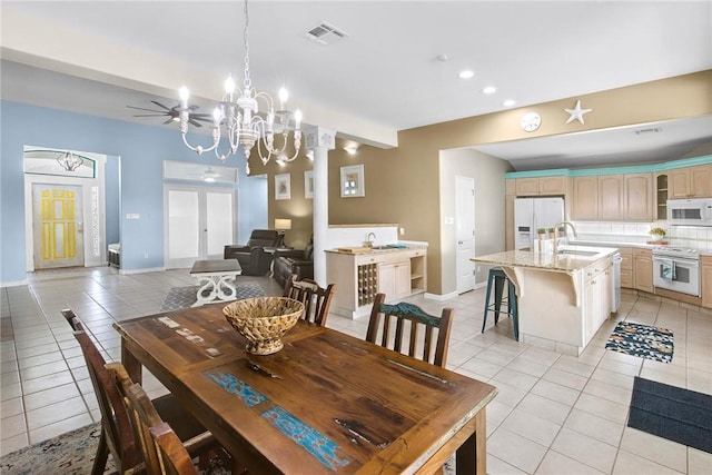dining area featuring light tile patterned floors, a chandelier, recessed lighting, and baseboards