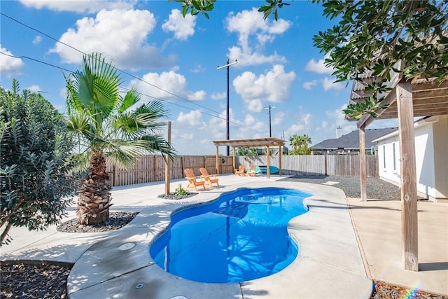 view of pool featuring a patio area and a fenced backyard