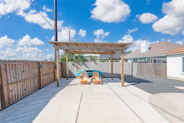 view of patio featuring a pergola and a fenced backyard