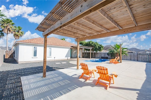 view of patio with a fenced backyard and a pergola