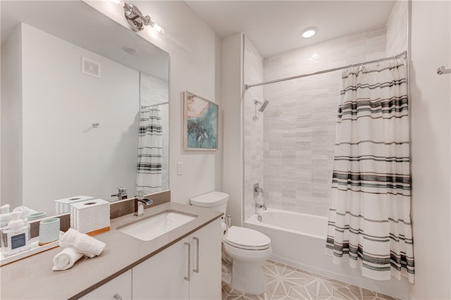 full bathroom featuring tile patterned flooring, vanity, shower / bath combo with shower curtain, and toilet