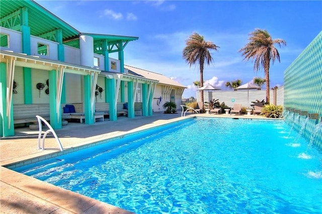 view of swimming pool with a patio area