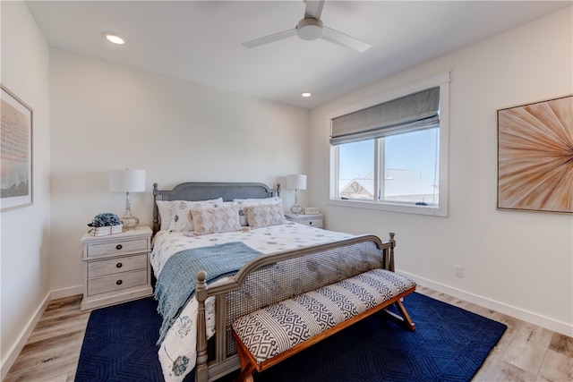 bedroom with light wood-type flooring and ceiling fan